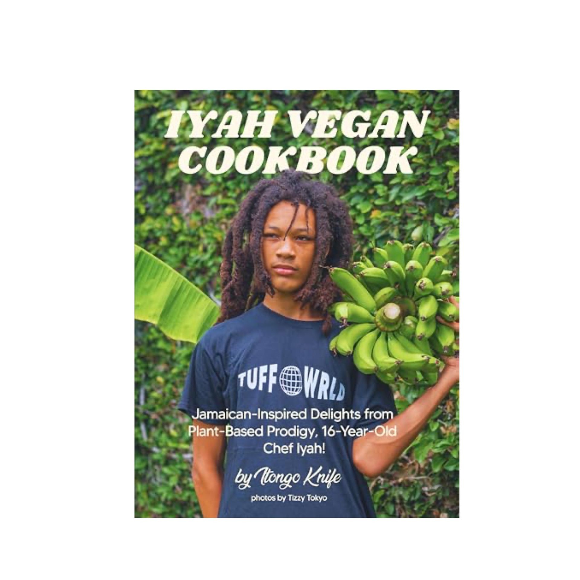 Cover of Iyah Vegan Cookbook featuring a person holding green bananas against a leafy background.